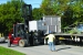 Workers load boxes containing contaminated soil that surrounded Tank W-1A.