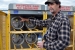 Mike Tidwell performs a leak check and inspection on propane tanks