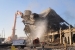 Workers tear down the remaining structure of the K-25 North End this morning.