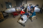 At Sandia National Laboratories, researchers have developed pods that can survey and "taste" radioactive particles without exposing a human crew to nuclear hazards. The three pods, when attached to aerial vehicles, can collect and analyze airborne radioactive particles to track and source gases that can identify a nuclear bomb’s origins. Learn more about the <a href="http://share.sandia.gov/news/resources/news_releases/airborne_pods/" target="_blank">particulate-collection system</a>. | Photo courtesy of Randy Montoya/Sandia National Laboratories.