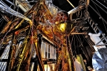 The James Webb Space Telescope is a large, infrared-optimized telescope that is anticipated to launch in 2018. The spider-like sheets and tubes of wires you see here are the Optical Telescope Simulator (OSIM) for the telescope itself. OSIM will help scientists prepare the Webb telescope for flight by generating a beam of light that the telescope optics will feed into its actual flight instruments. 
 
In this photo, engineers have blanketed the OSIM with special insulating material to help control its temperature while it goes into the deep freeze testing of the Space Environment Simulator at NASA's Goddard Space Flight Center in Greenbelt, Maryland. The simulator will mimic the environment that the telescope will experience in operational orbit, more than 1 million miles from Earth. | Photo credit: Chris Gunn/NASA.