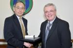 Secretary Chu hands a Secretarial Achievement Awards to Louis Sadler, who negotiating an agreement to allow a private company to construct and operate solar panels at Brookhaven National Laboratory. The solar array supplies electricity for Long Island while helping the lab achieve its sustainability goals. | Energy Department Photo