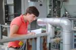 Spencer Isom, second year engineering intern for Savannah River Remediation (SRR) and fourth summer at Savannah River Site (SRS), performs a standard equipment check at Saltstone Production Facility. | Photo courtesy of Savannah River Site
