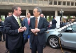 Secretary Chu, right, discusses electric vehicles with Brian Wynne, president of the Electric Drive Transportation Association, at an event in 2011.