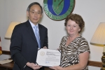 Secretary Chu presents the Secretary of Energy's Appreciation Award to Judy A. McLemore.