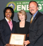 DOE Office of Economic Impact and Diversity Director Dot Harris, left, presents the Sub-to-Prime Small Business Champion of the Year Award to EM Small Business Advocate Kay Rash, center, and EM Deputy Assistant Secretary for Acquisition and Project Management Jack Surash during DOE’s Fiscal Year 2011 DOE Secretarial Small Business Awards Program Wednesday.