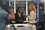 Dot Harris speaking live to WBIR, a local Knoxville television station, the morning of the Energy Department/National Nuclear Security Administration Small Business Summit (July 10). Photo: DOE Photographer Lynn Frenny