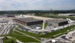 Workers near completion of the non-technetium area of K-25’s east wing (left). Oak Ridge anticipates beginning demolition on the North Tower (right) by October.