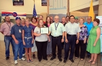 DOE Carlsbad Field Office Deputy Manager Ed Ziemianski presents a Waste Isolation Pilot Plant (WIPP) team with the Green Zia Program Silver Level Leader award from the New 
Mexico Environment Department earlier this month in recognition of environmental initiatives. Shown right of Ziemianski is Farok Sharif, Washington TRU Solutions LLC, the WIPP management and operating contractor, President and General Manager.