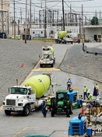 Cement trucks transport a specially formulated grout that is pumped into two underground waste tanks at the Savannah River Site as part of work to close the massive structures.