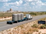 A Waste Isolation Pilot Plant (WIPP) truck approaches the WIPP facility near Carlsbad, N.M. Since opening in 1999, WIPP has established an impressive record. In addition to transporting more than 10,500 shipments safely, WIPP drivers have logged more than 12.6 million safe loaded miles — equivalent to 26 roundtrips to the moon — without a serious accident or injury. Their work has helped DOE clean up 22 transuranic waste sites around the nation.