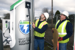 Workers put the finishing touches on installing a plug-in electric vehicle charger that is part of the West Coast Electric Highway. | Photo courtesy of Columbia-Willamette Clean Cities Coalition.