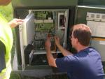 Technicians implement smart meters as part of the Naperville Smart Grid Initiative, which is projected to save the city $3 million a year over a 15 year period. | Photo courtesy of Naperville