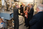 Dave Huizenga, head of EM, fifth from right, and Secretary of Energy Steven Chu, second from right, participate in a tour of Catholic University's Vitreous State Laboratory this week.