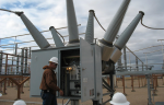 An electrician foreman for the Western Area Power Administration checks a circuit breaker at the Ault Substation in eastern Colorado.  The circuit breaker, containing 85 lbs of SF6, protects equipment in the substation against damage from excessive electrical currents | Courtesy of Western Area Power Administration.