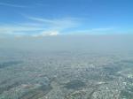 A heavy layer of air pollution, a mix of aerosol particles and vapors, obscures the view over Mexico City. Two studies by the Pacific Northwest National Laboratory show the importance of including the small-scale effects of aerosols in climate modeling. | Image courtesy of PNNL