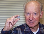Dr. Karl Gschneidner is holding a neodymium-iron-boron magnet produced using a new, greener process. The process that Dr. Gschneidner helped develop doesn’t produce the environmentally unfriendly byproducts that result from traditional manufacturing methods. | Photo courtesy of Ames Laboratory.