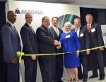 Vehicle Technologies Program Manager Patrick B. Davis gets ready to cut the ribbon at Magna E-Car's new electric drive component plant in Michigan. From left: Mike Finney - CEO, Michigan Economic Development Corporation; Gary Meyers - VP/General Manager, Magna E-Car USA, LP; Pat Davis; Kevin Pavlov - Chief Operating Officer, Magna E-Car Systems; Marilyn Hoffman, Township Supervisor, Grand Blanc Township, Michigan; Joseph Graves, State Representative 51st District, Michigan House of Representatives; Tim Herman, CEO, The Genesee County Chamber of Commerce. | Photo courtesy of Magna E-Car. 