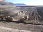 Scrapers excavate the Crescent Junction disposal cell 25 feet below ground surface.