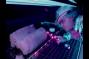 A scientist uses ultra-violet light to study how fluids move through rock