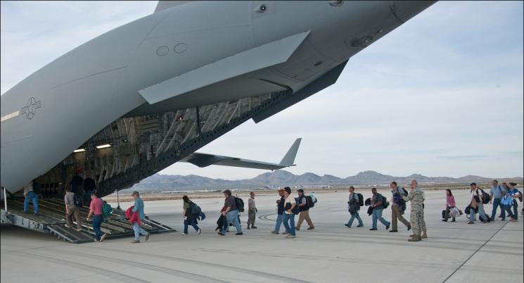 National Security Technologies scientists, technicians and engineers from the National Nuclear Security Administration’s Nevada Site Office board the Air Force C-17. Highly trained nuclear emergency response personnel and more than 17,000 lbs of hi-tech equipment were sent to Japan as part of the Department of Energy and National Nuclear Security Administration’s effort to assist Japanese personnel with nuclear issues. | Photo Courtesy NNSA News National Security Technologies scientists, technicians and engineers from the National Nuclear Security Administration’s Nevada Site Office board the Air Force C-17. Highly trained nuclear emergency response personnel and more than 17,000 lbs of hi-tech equipment were sent to Japan as part of the Department of Energy and National Nuclear Security Administration’s effort to assist Japanese personnel with nuclear issues. | Photo Courtesy NNSA News